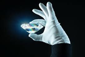 Diamond held by glove Diamond held by glove